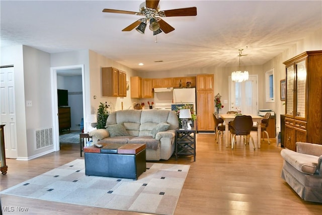 252 Greenbriar Dr, Cortland, OH 44410 - living room featuring a chandelier, light wood-style floors, and ceiling fan