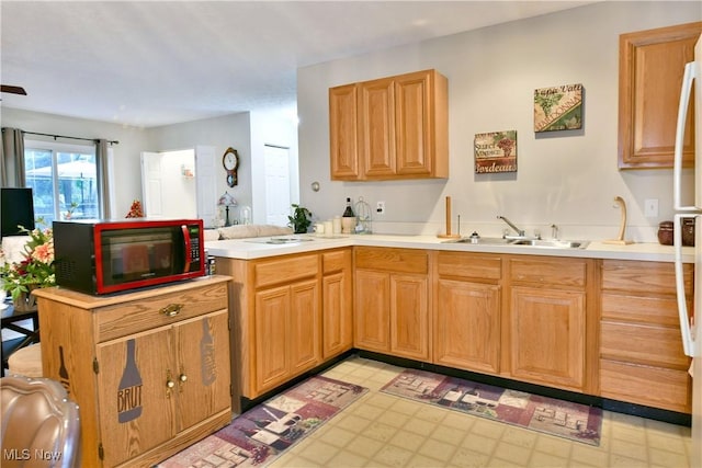 252 Greenbriar Dr, Cortland, OH 44410 - kitchen featuring light countertops, light floors, and a peninsula