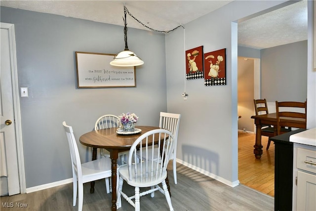 252 Greenbriar Dr, Cortland, OH 44410 - dining room with light wood finished floors and baseboards