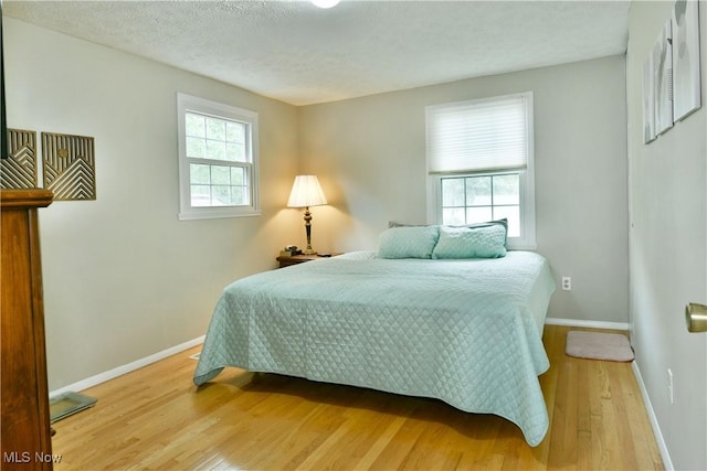 252 Greenbriar Dr, Cortland, OH 44410 - bedroom featuring wood finished floors and a textured ceiling