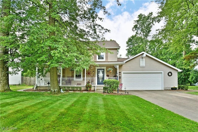 252 Greenbriar Dr, Cortland, OH 44410 - view of front facade with a porch, an attached garage, driveway, and a front lawn