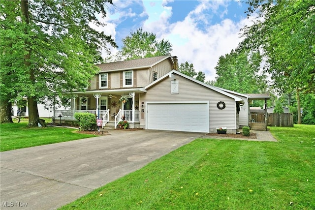 252 Greenbriar Dr, Cortland, OH 44410 - view of front of property with covered porch, an attached garage, concrete driveway, and a chimney