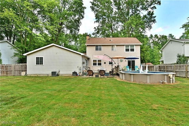 252 Greenbriar Dr, Cortland, OH 44410 - back of property with a fenced backyard and a chimney