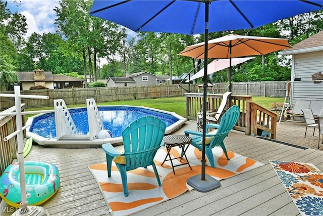 252 Greenbriar Dr, Cortland, OH 44410 - wooden terrace with a fenced backyard and view of wooded area