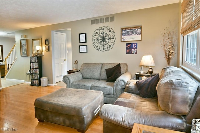 252 Greenbriar Dr, Cortland, OH 44410 - living area with stairs and wood finished floors