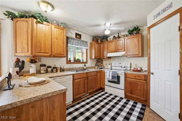 3823 Kyle Rd, Dorset, OH 44032 - kitchen featuring white appliances, under cabinet range hood, light countertops, a ceiling fan, and light tile patterned floors