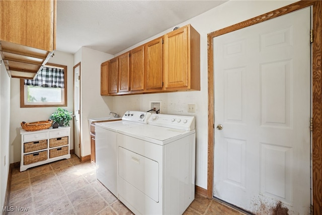 3823 Kyle Rd, Dorset, OH 44032 - laundry room featuring separate washer and dryer and cabinet space