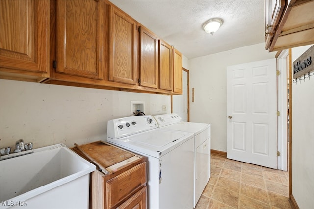 3823 Kyle Rd, Dorset, OH 44032 - laundry area with cabinet space, separate washer and dryer, stone finish floors, and a textured ceiling