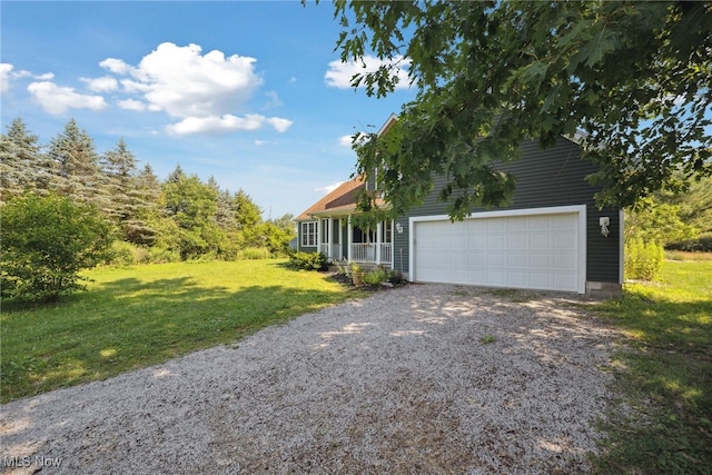 3823 Kyle Rd, Dorset, OH 44032 - view of side of property with a lawn, gravel driveway, and a garage