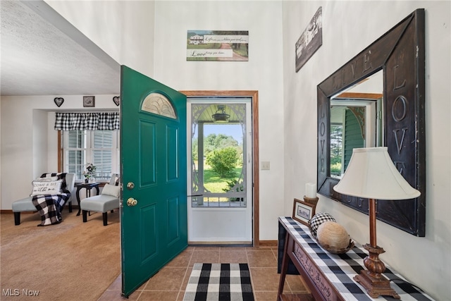 3823 Kyle Rd, Dorset, OH 44032 - tiled foyer entrance featuring a towering ceiling and a textured ceiling
