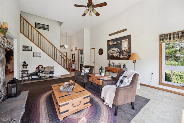 3823 Kyle Rd, Dorset, OH 44032 - living area featuring stairs, a high ceiling, carpet floors, and ceiling fan