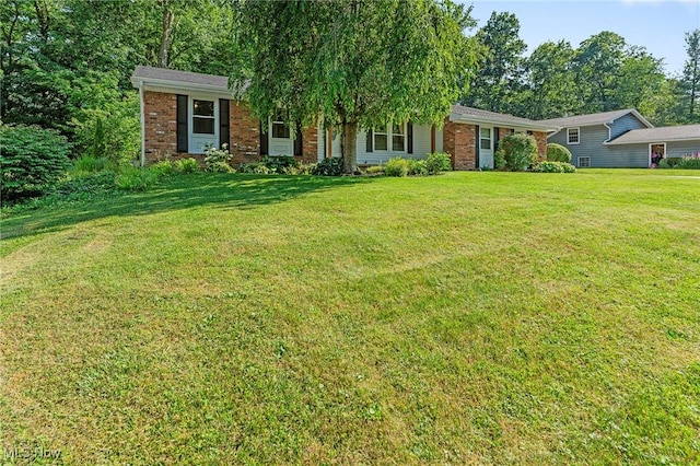 300 Chatham Dr, Aurora, OH 44202 - view of front of house with brick siding and a front lawn