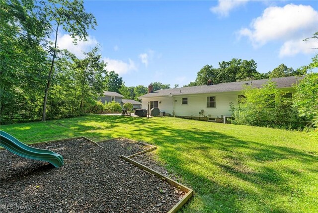 300 Chatham Dr, Aurora, OH 44202 - view of grassy yard featuring a playground