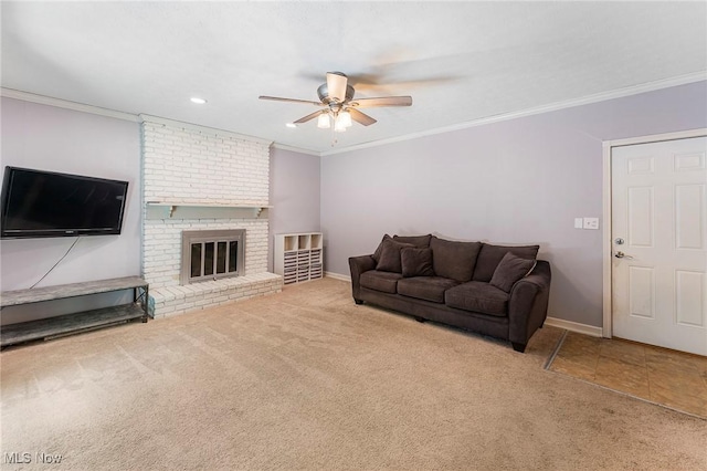 300 Chatham Dr, Aurora, OH 44202 - carpeted living room featuring a ceiling fan, crown molding, a brick fireplace, and recessed lighting