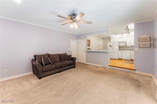 300 Chatham Dr, Aurora, OH 44202 - living area featuring light colored carpet, crown molding, and a ceiling fan