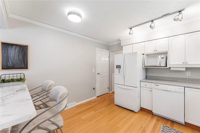 300 Chatham Dr, Aurora, OH 44202 - kitchen with white appliances, white cabinetry, light wood finished floors, crown molding, and light countertops