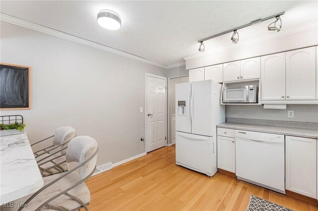300 Chatham Dr, Aurora, OH 44202 - kitchen with white appliances, white cabinetry, light wood finished floors, light countertops, and ornamental molding