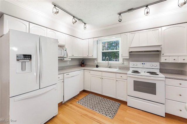 300 Chatham Dr, Aurora, OH 44202 - kitchen with white appliances, track lighting, crown molding, custom exhaust hood, and white cabinetry