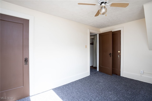 289-2891/2 E Baird Ave, Barberton, OH 44203 - unfurnished bedroom with carpet flooring, a textured ceiling, and ceiling fan