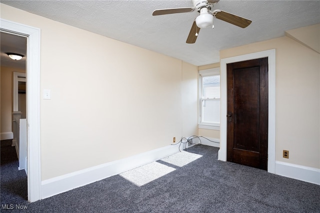 289-2891/2 E Baird Ave, Barberton, OH 44203 - unfurnished bedroom featuring carpet flooring, ceiling fan, and a textured ceiling