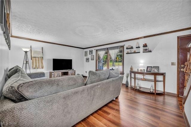 9827 Akron Rd, Rittman, OH 44270 - living area featuring ornamental molding, a textured ceiling, and wood finished floors
