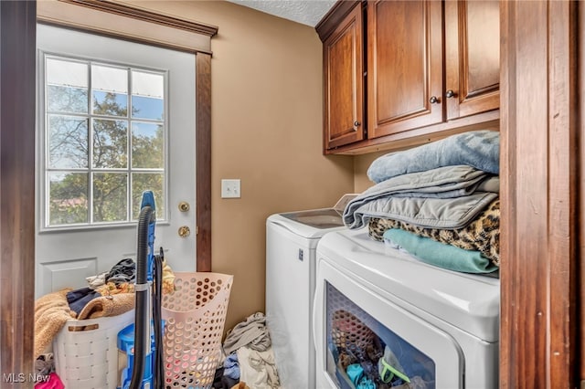 9827 Akron Rd, Rittman, OH 44270 - laundry area featuring cabinet space and washing machine and dryer