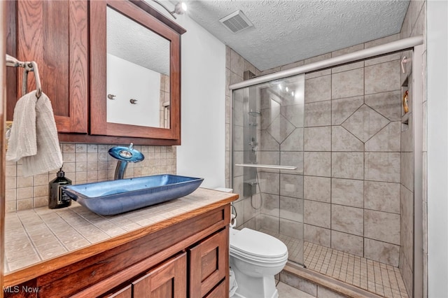 9827 Akron Rd, Rittman, OH 44270 - full bath featuring a textured ceiling, vanity, and a stall shower