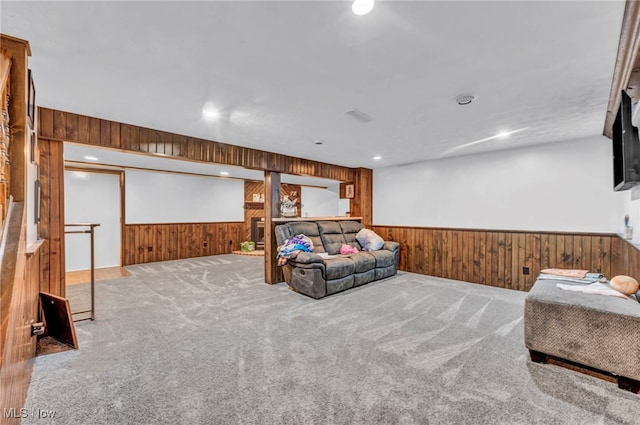9827 Akron Rd, Rittman, OH 44270 - living area featuring wood walls, wainscoting, carpet flooring, and recessed lighting