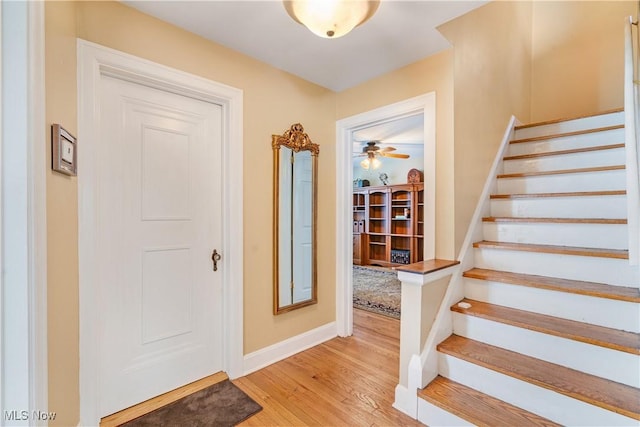 6100 Glenwood Ave, Boardman, OH 44512 - entryway with stairway, light wood-style floors, and ceiling fan