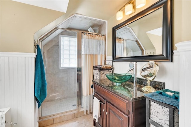 6100 Glenwood Ave, Boardman, OH 44512 - bathroom featuring vanity, a shower stall, a wainscoted wall, and tile patterned floors
