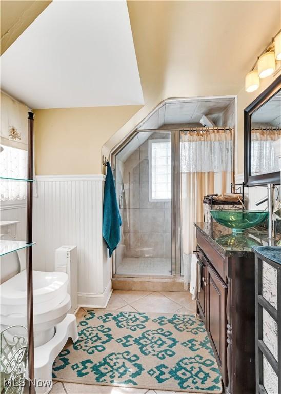 6100 Glenwood Ave, Boardman, OH 44512 - bathroom featuring tile patterned flooring, vanity, and a shower stall
