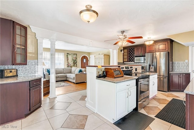 6100 Glenwood Ave, Boardman, OH 44512 - kitchen with appliances with stainless steel finishes, decorative columns, ceiling fan, and decorative backsplash
