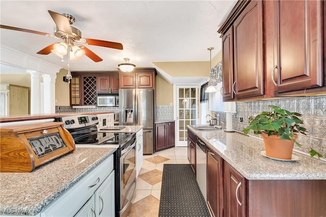 6100 Glenwood Ave, Boardman, OH 44512 - kitchen with stainless steel appliances, tasteful backsplash, light tile patterned floors, ceiling fan, and light stone counters