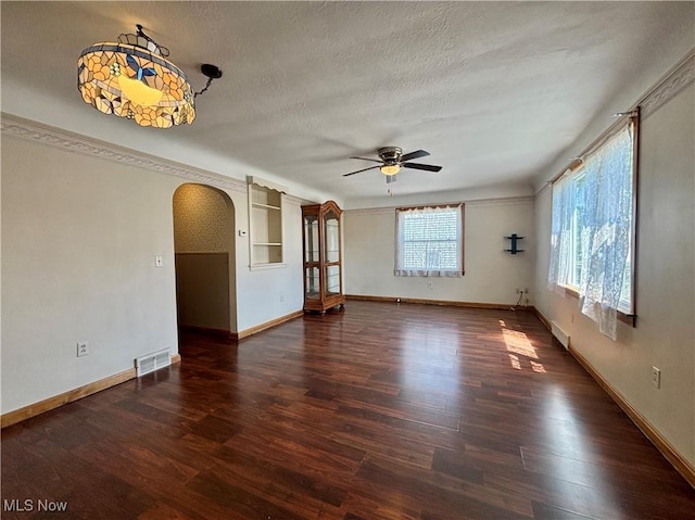 3109 Latimer Ave, Ashtabula, OH 44004 - empty room featuring arched walkways, a ceiling fan, wood finished floors, and a textured ceiling