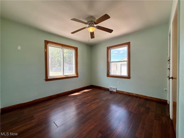3109 Latimer Ave, Ashtabula, OH 44004 - spare room featuring healthy amount of natural light, dark wood-type flooring, and a ceiling fan