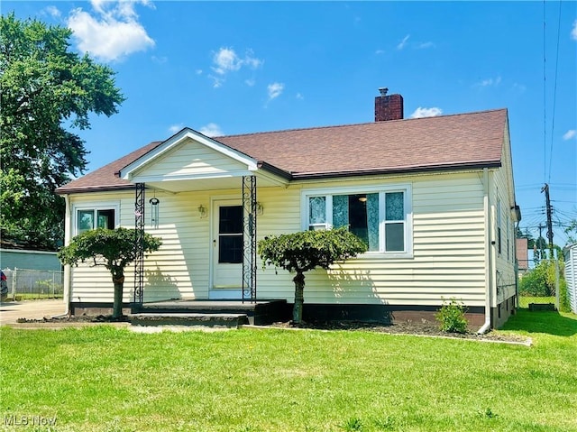 3109 Latimer Ave, Ashtabula, OH 44004 - view of front of house with a chimney, a front lawn, and roof with shingles