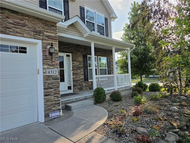 4312 Brooks Ct, Lorain, OH 44053 - view of exterior entry with a porch and stone siding