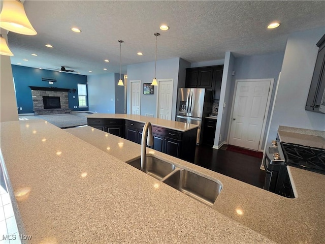 4312 Brooks Ct, Lorain, OH 44053 - kitchen with a kitchen island, ceiling fan, stainless steel refrigerator with ice dispenser, recessed lighting, and open floor plan