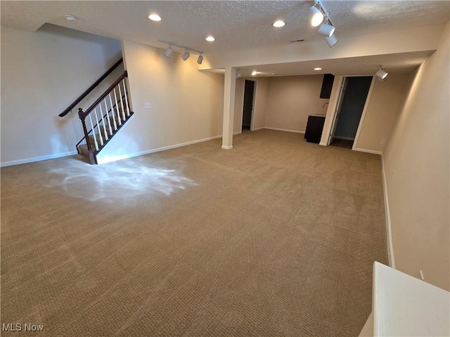 4312 Brooks Ct, Lorain, OH 44053 - finished below grade area featuring track lighting, carpet, stairway, a textured ceiling, and recessed lighting