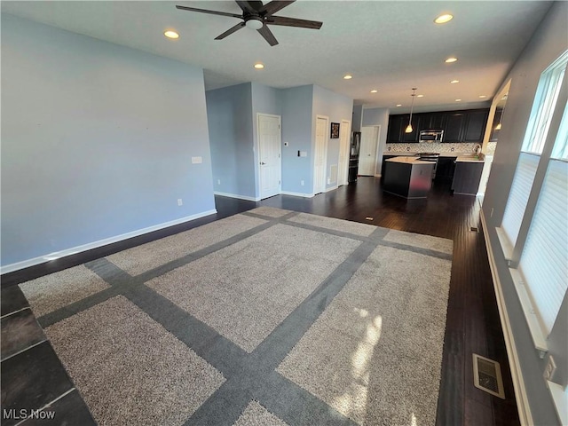 4312 Brooks Ct, Lorain, OH 44053 - unfurnished living room featuring recessed lighting, a ceiling fan, and dark wood-style floors