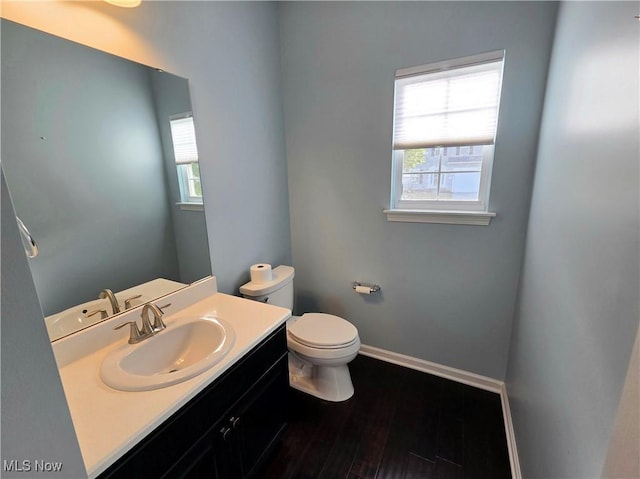 4312 Brooks Ct, Lorain, OH 44053 - half bath featuring plenty of natural light, vanity, and wood finished floors