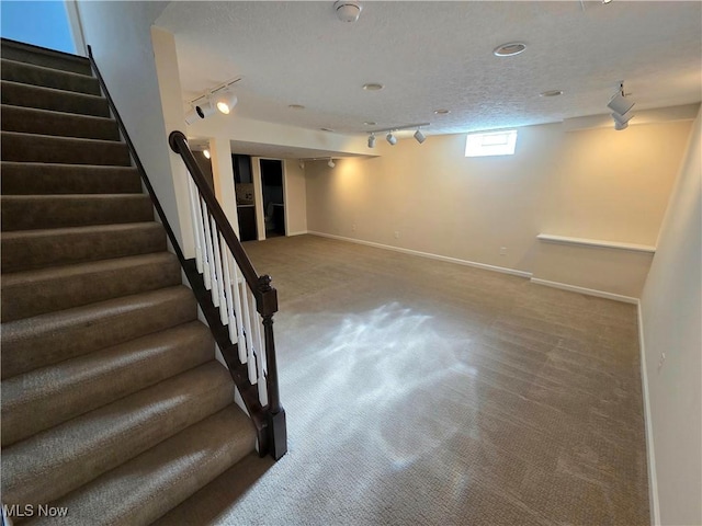 4312 Brooks Ct, Lorain, OH 44053 - below grade area with track lighting, carpet, and stairway