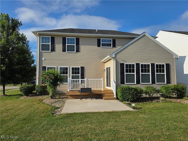 4312 Brooks Ct, Lorain, OH 44053 - rear view of property featuring a patio, a yard, and a deck