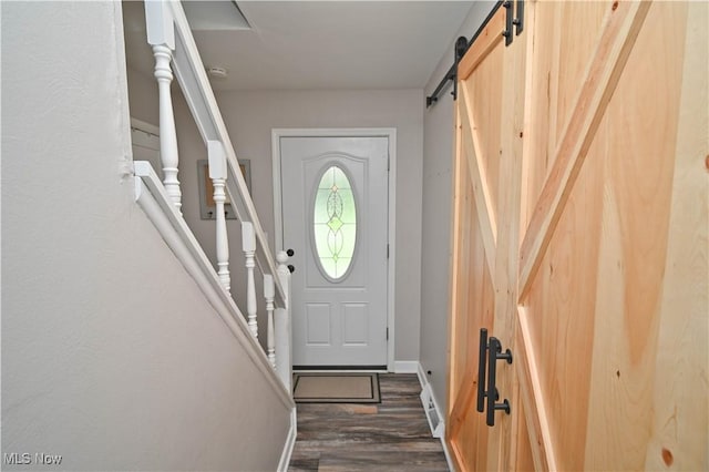 48 Mary Ann Ln, Youngstown, OH 44511 - doorway featuring a barn door and dark wood finished floors