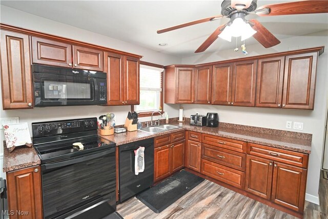 48 Mary Ann Ln, Youngstown, OH 44511 - kitchen featuring black appliances, ceiling fan, wood finished floors, and brown cabinetry