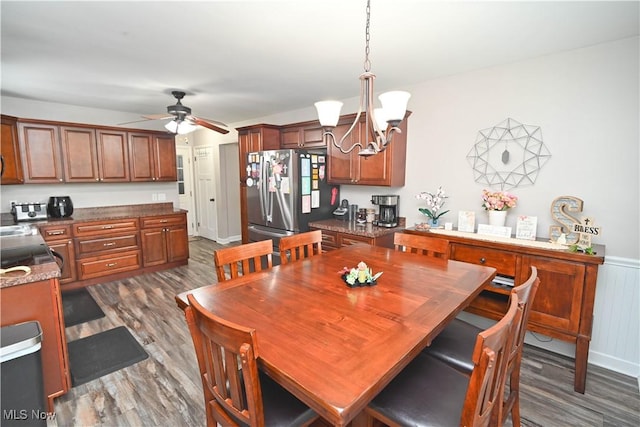 48 Mary Ann Ln, Youngstown, OH 44511 - dining area with dark wood finished floors, a chandelier, a ceiling fan, and wainscoting
