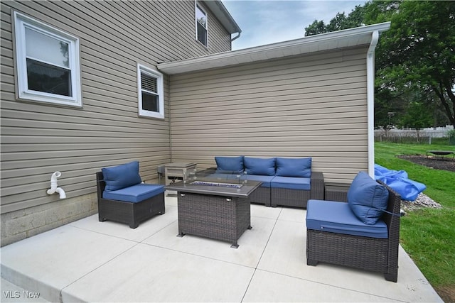 48 Mary Ann Ln, Youngstown, OH 44511 - view of patio with an outdoor living space with a fire pit
