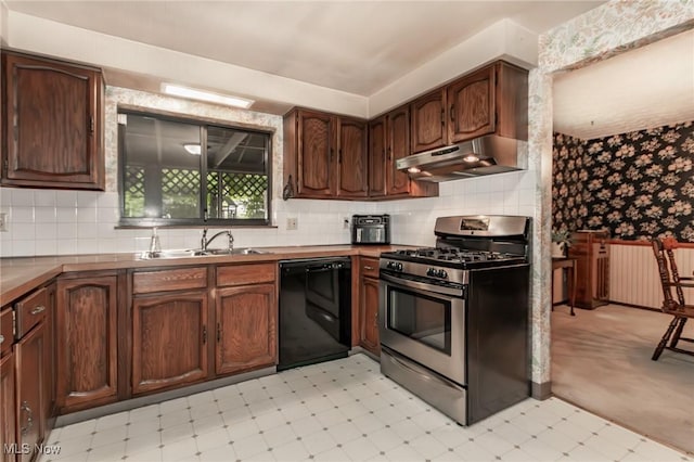 751 Bacon Rd, Oh, OH 44077 - kitchen with dishwasher, stainless steel gas range oven, under cabinet range hood, wallpapered walls, and light floors