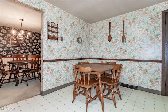 751 Bacon Rd, Oh, OH 44077 - dining room featuring tile patterned floors, a chandelier, and wallpapered walls