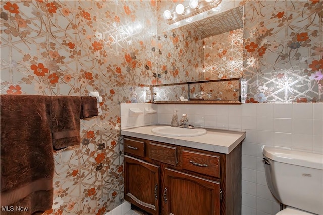 751 Bacon Rd, Oh, OH 44077 - bathroom featuring vanity and wallpapered walls